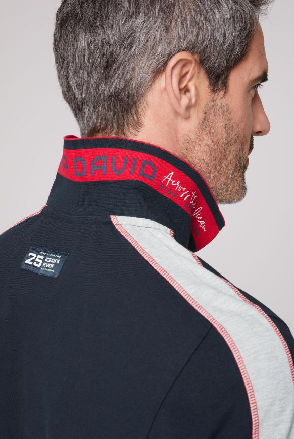 Pikee-Polo mit Farbstreifen und Logo-Stickereien