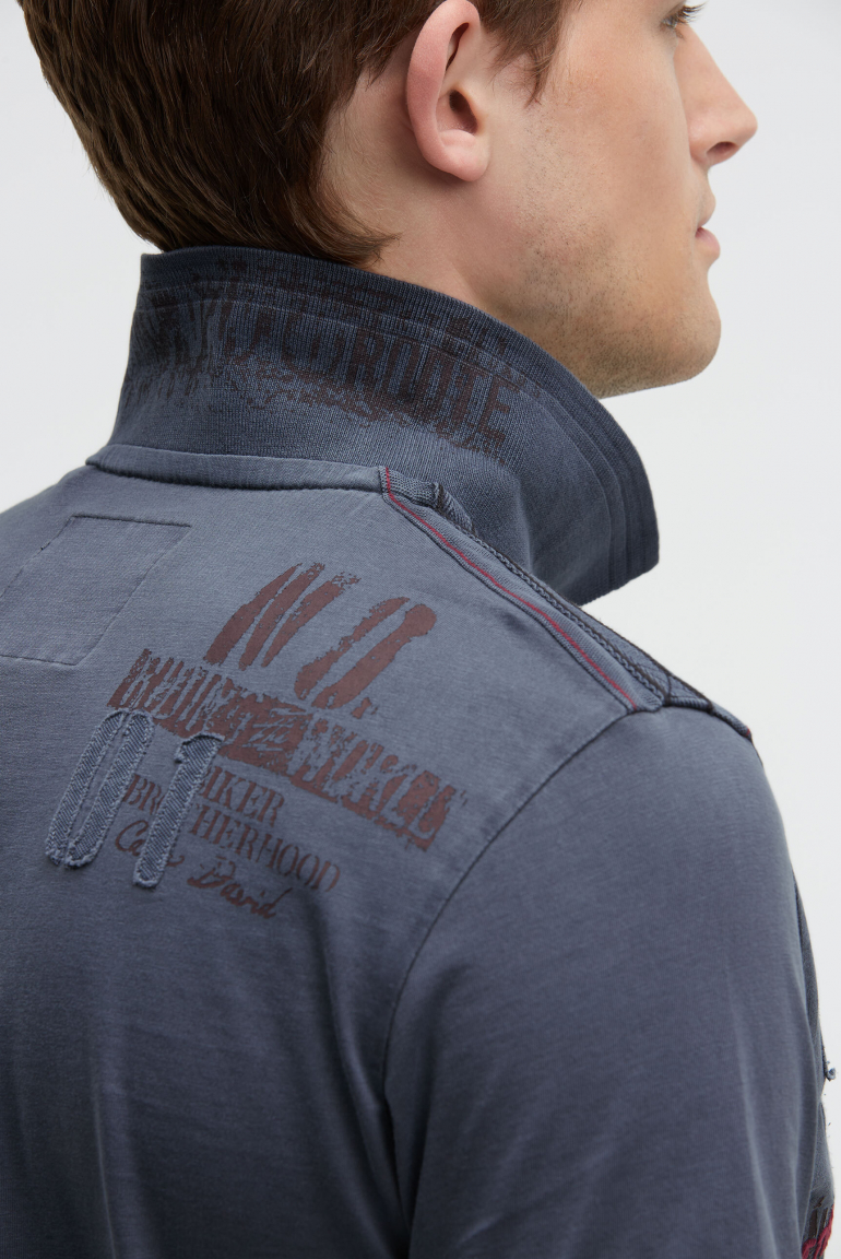 Kurzarmpolo mit Tapes und Logo-Applikationen
