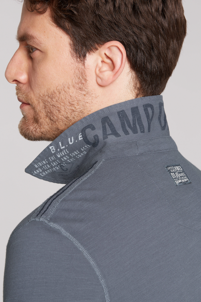 Polo aus Flammgarn-Pikee mit Label-Applikationen